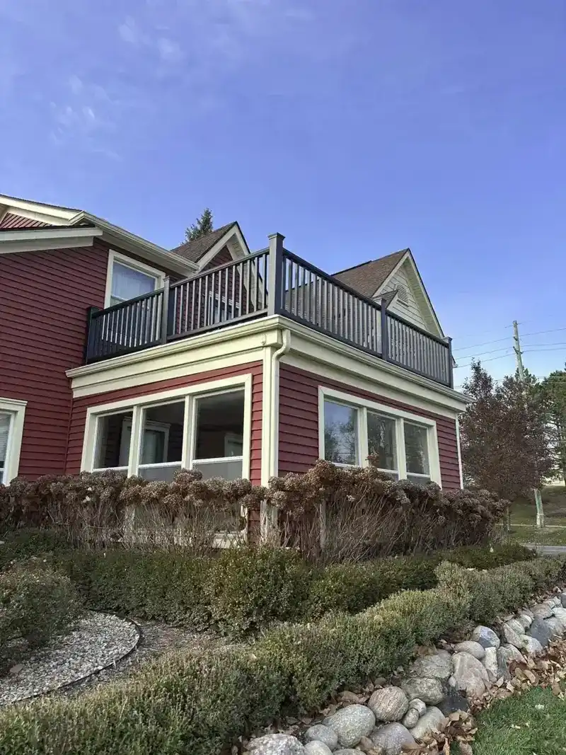 Completed balcony waterproofing on a two-story home
