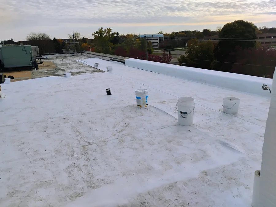 Wide view of completed commercial flat roof installation in Oakland County