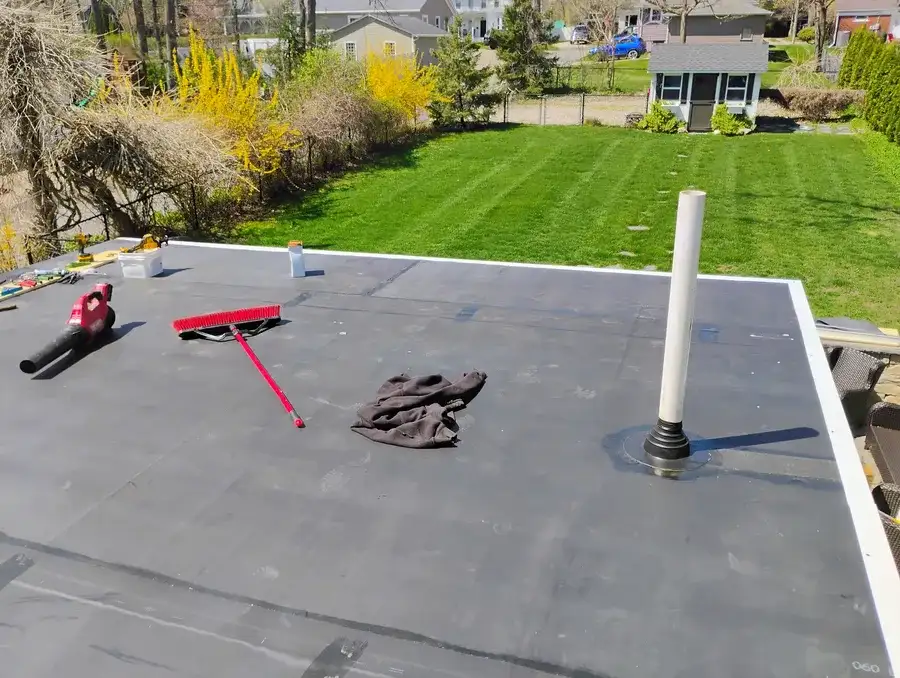 EPDM rubber roof installation in progress on a residential property